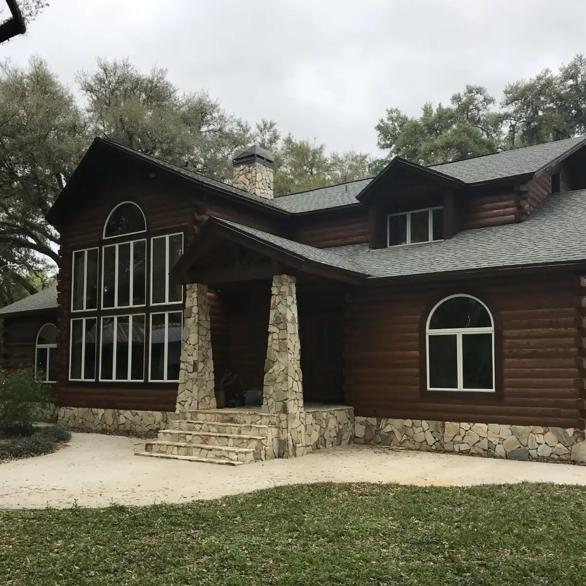 luxury log cabin with brick supports