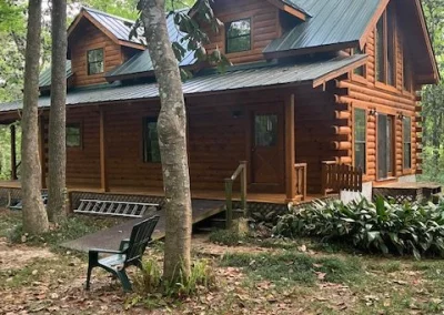 Log cabin in the woods with deck and brand new roofing