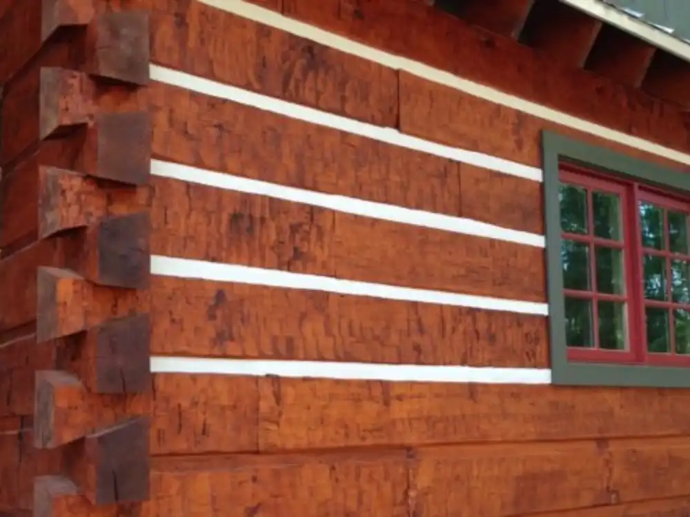 Log cabin stained with painted windows